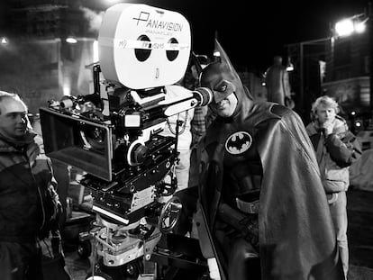 Micheal Keaton in full costume behind the camera during the filming of 'Batman', in 1989.