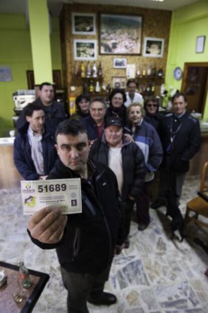 The mayor of Ruerrero, Julio Espinosa, in the local bar with his fellow villagers.