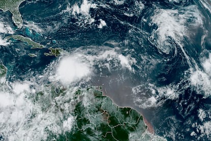 In this Monday, Aug. 21, 2023, 9:03 a.m. ET satellite image provided by the National Oceanic and Atmospheric Administration, Tropical Storm Franklin moves south of Hispaniola island.