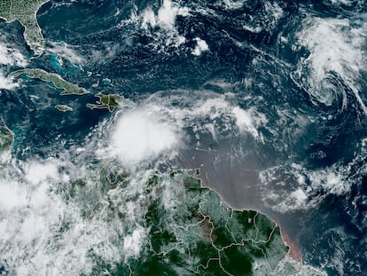 In this Monday, Aug. 21, 2023, 9:03 a.m. ET satellite image provided by the National Oceanic and Atmospheric Administration, Tropical Storm Franklin moves south of Hispaniola island.
