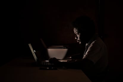 Milo Milford, 36, a freelance journalist, in his office.