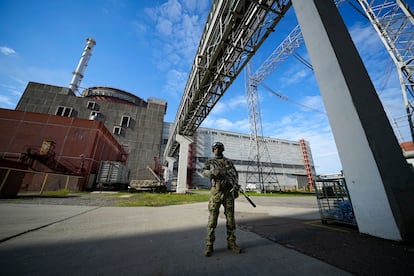A Russian serviceman guards an area of the Zaporizhzhia Nuclear Power Station in territory under Russian military control in May 2022. 