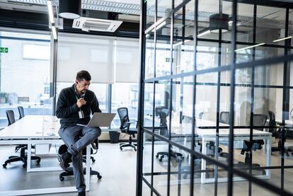 Mature man working using laptop in the office