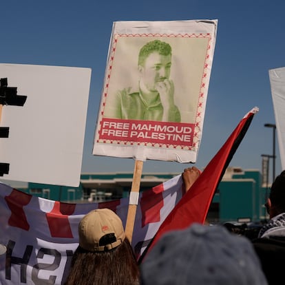 Protesters hold a sign for Mahmoud Khalil, a recently detained Palestinian activist, in Newark, N.J., Tuesday, March 11, 2025. The protest was held in front of Delaney Hall, the proposed site of an immigrant detention center. (AP Photo/Seth Wenig)