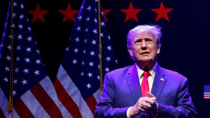 Former U.S. President Donald Trump takes the stage in a campaign rally with supporters, in Davenport, Iowa, U.S. March 13, 2023.