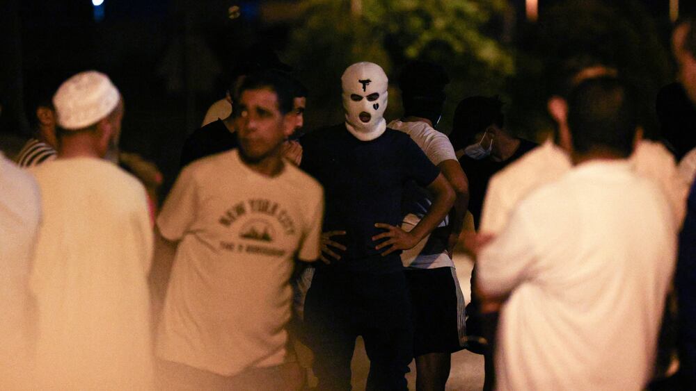 People gather on a street, amid anti-migrant unrest following an attack on an elderly man by unknown assailants earlier in the week, in Torre Pacheco, Spain, July 14, 2025. REUTERS/Violeta Santos Moura