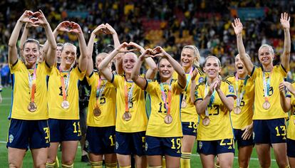 Sweden players celebrate after finishing in third place.