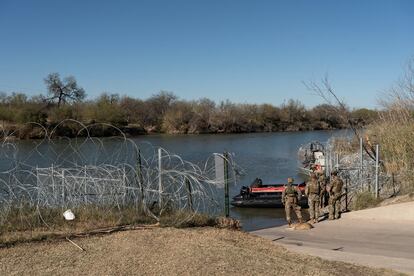 Migrants cross the border into Texas from Mexico