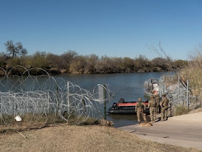 U.S. National Guard soldiers stand at a boat ramp on the bank of the Rio Grande river in Eagle Pass, Texas, U.S., January 17, 2024.