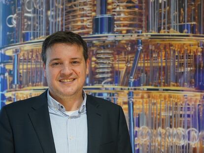IBM's Juan Bernabé-Moreno in front of an image of one of the company's quantum computers.