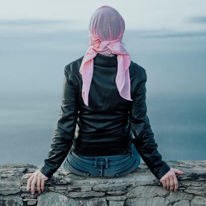 woman with pink headscarf, has cancer