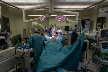 A group of doctors performing surgery in a hospital in Barcelona.