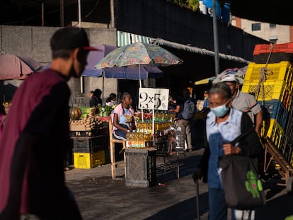 Venezuelans shop at an open-air market in Caracas.