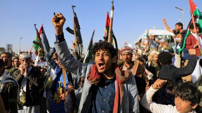 Yemeni demonstrators shout slogans during a protest following U.S. and British strikes, in the Houthi-controlled capital Sana'a on January 12, 2024.