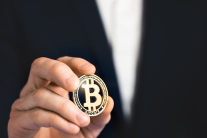 Businessman holding bitcoin. Business success concept. Close-up soft focus image