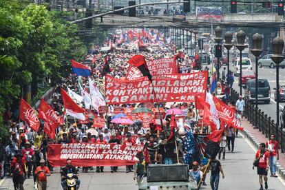 Trabajadores en Manilo (Filipinas).