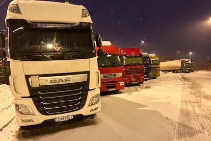 Ukrainian truck drivers wait to cross from Poland back into Ukraine in Korczowa, Poland, on Thursday Dec. 7, 2023