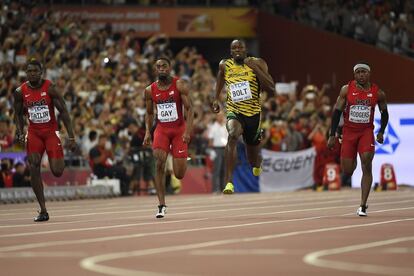 Justin Gatlin,Tyson Gay, Usain Bolt i Mike Rodgers, durant la carrera.