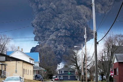 A black plume rises over East Palestine, Ohio, as a result of a controlled detonation of a portion of the derailed Norfolk Southern trains, on February 6, 2023.