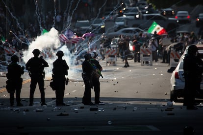 Los Angeles on June 11, 2025, with several police officers charging protesters following protests over immigration arrests.