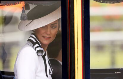 Kate Middleton looks out the window of the float during her participation in the'Trooping the Color' parade in London.