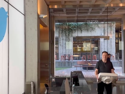 This image from the Twitter page of Elon Musk shows Musk entering Twitter headquarters carrying a sink through the lobby area on Wednesday, Oct. 26, 2022 in San Francisco.