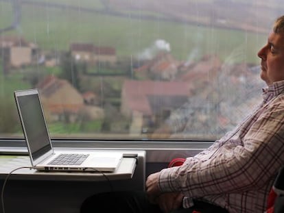 A passenger relaxes on Spain’s high-speed AVE service.