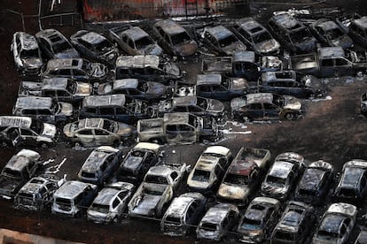  An aerial image taken on August 10, 2023 shows destroyed cars in Lahaina in the aftermath of wildfires in western Maui, Hawaii. 