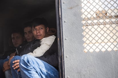 Migrants wait in a Border Guard vehicle after being detained, in Ruby, Arizona, in June 2024.