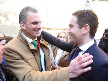 Vox's J. Ortega Smith (r) greets T. García Egea of the PP.