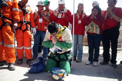 One of the miners prays after being rescued.