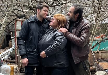 Viktor, Vika and their son Kostia, in the courtyard of their house in Kherson.