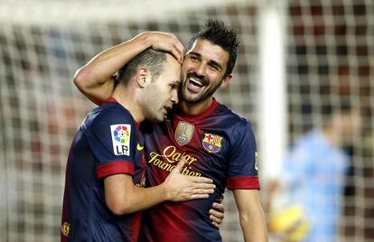 Villa e Iniesta festejan un gol del Barça.