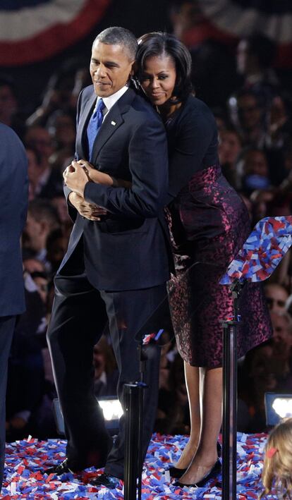 U.S. President Obama is embraced by first lady Michelle Obama after his victory speech during his election night rally in Chicago