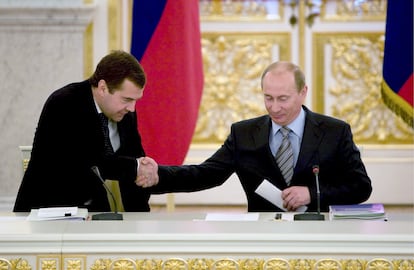 Russian President Vladimir Putin greets the then deputy prime minister and presidential candidate, Dmitri Medvedev, after his speech in the Kremlin, on February 28, 2008.