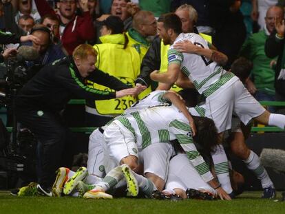 Celtic&#039;s manager Neil Lennon (l) joins in the celebration of the winning goal against Shakhter Karagandy during their Champions League playoff round second leg at Celtic Park. 
 