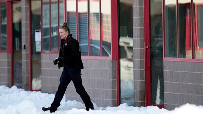 A law enforcement officer exits the Starts Right Here building, Monday, Jan. 23, 2023, in Des Moines, Iowa.