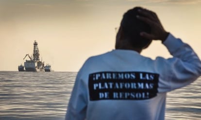 A conservationist observing Repsol's drilling ship last November.