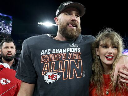 Travis Kelce of the Kansas City Chiefs celebrates with Taylor Swift after a 17-10 victory against the Baltimore Ravens in the AFC Championship Game at M&T Bank Stadium on January 28, 2024.