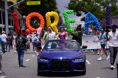 The cosmetics brand L'Oréal is spelled with colorful balloons at the WeHo Pride Parade in West Hollywood, California, on Sunday, June 4, 2023.