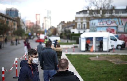 People waiting in line for a coronavirus test in London on Friday.