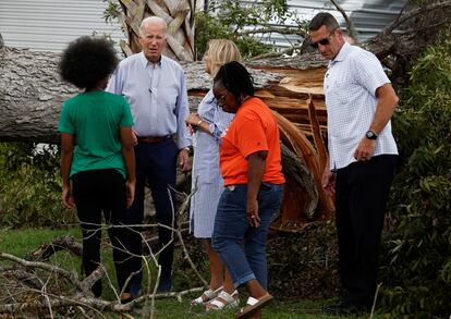 U.S. President Joe Biden and first lady Jill Biden talk with people as they tour Hurricane Idalia storm destruction in a neighborhood of Live Oak, Florida, U.S., September 2, 2023.