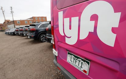 A Lyft ride-hailing vehicle is parked near Empower Field at Mile High in Denver on April 30, 2020