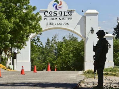 A soldier guards the entrance of a military base outside Cosalá, Sinaloa, Mexico.