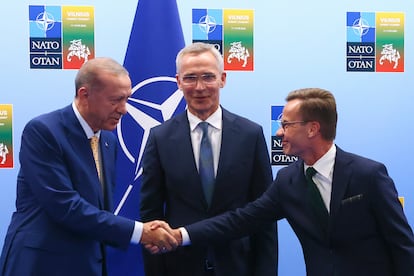 Turkey's President Recep Tayyip Erdogan, left, shakes hands with Sweden's Prime Minister Ulf Kristersson, right, as NATO Secretary General Jens Stoltenberg looks on prior to a meeting ahead of a NATO summit in Vilnius, Lithuania, Monday, July 10, 2023.