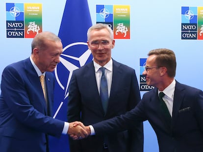Turkey's President Recep Tayyip Erdogan, left, shakes hands with Sweden's Prime Minister Ulf Kristersson, right, as NATO Secretary General Jens Stoltenberg looks on prior to a meeting ahead of a NATO summit in Vilnius, Lithuania, Monday, July 10, 2023.
