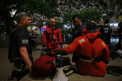 Firefighters prepare for rescue work of the Cuauhtémoc sailboat.