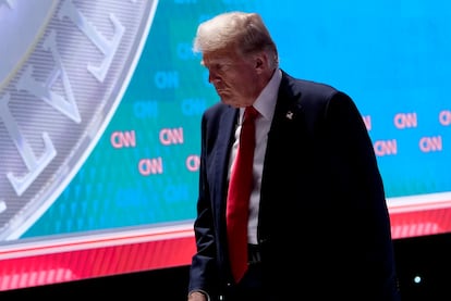 Republican White House candidate Donald Trump leaves the CNN studios in Atlanta during a break.