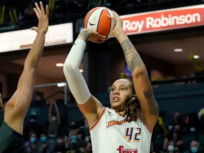 Phoenix Mercury's Brittney Griner (42) shoots over Seattle Storm's Mercedes Russell in the first half of the second round of the WNBA basketball playoffs Sunday, Sept. 26, 2021, in Everett, Wash.