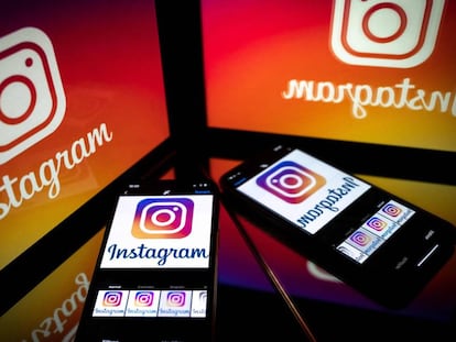 Móviles muestran la red social Instagram / AFP